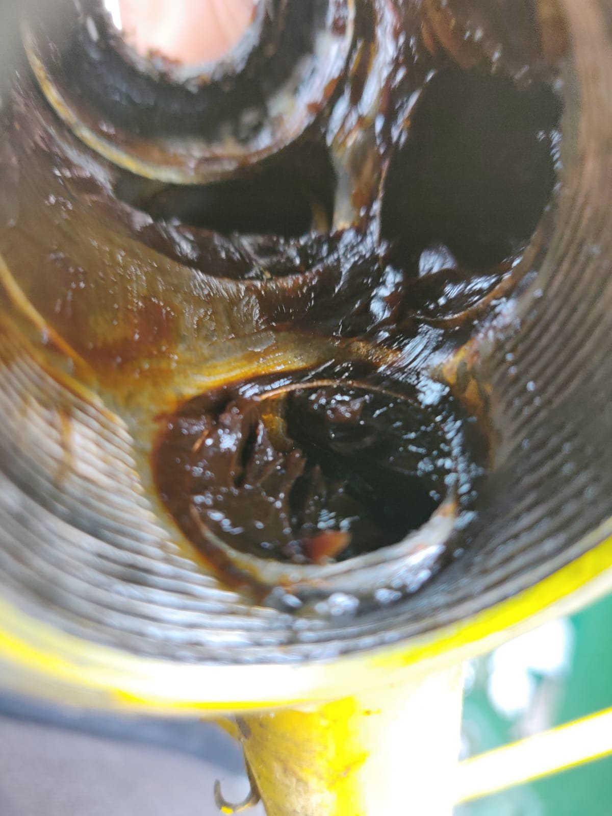picture of the inside of a bottom bracket with remaining old grease